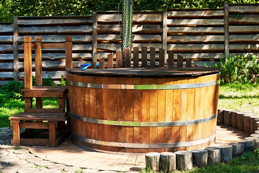 Rustic circular wooden hot tub